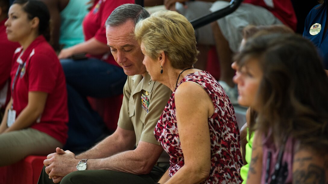 U.S. Marine Corps Commandant Gen. Joseph Dunford and his wife converse during the 2015 Department of Defense Warrior Games Sitting Volleyball at Marine Corps Base Quantico, Virginia, June 19-28, 2015.The Warrior Games, founded in 2010, is a Paralympic-style competition that features eight adaptive sports for wounded, ill, and injured service members and veterans from the U.S. Army, Marine Corp, Navy/Coast Guard, Air Force, Special Operations Command, and the British Armed Forces. This year marks the first time the DoD takes responsibility for operational planning and coordination of the event, in which approximately 250 athletes are expected to compete. 