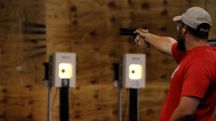Medically retired Marine Clayton McDaniel shoots the air pistol in the shooting competition at the 2015 DoD Warrior Games at Marine Corps Base Quantico, Virginia, June 26, 2015. McDaniel earned a gold medal in the event. 
