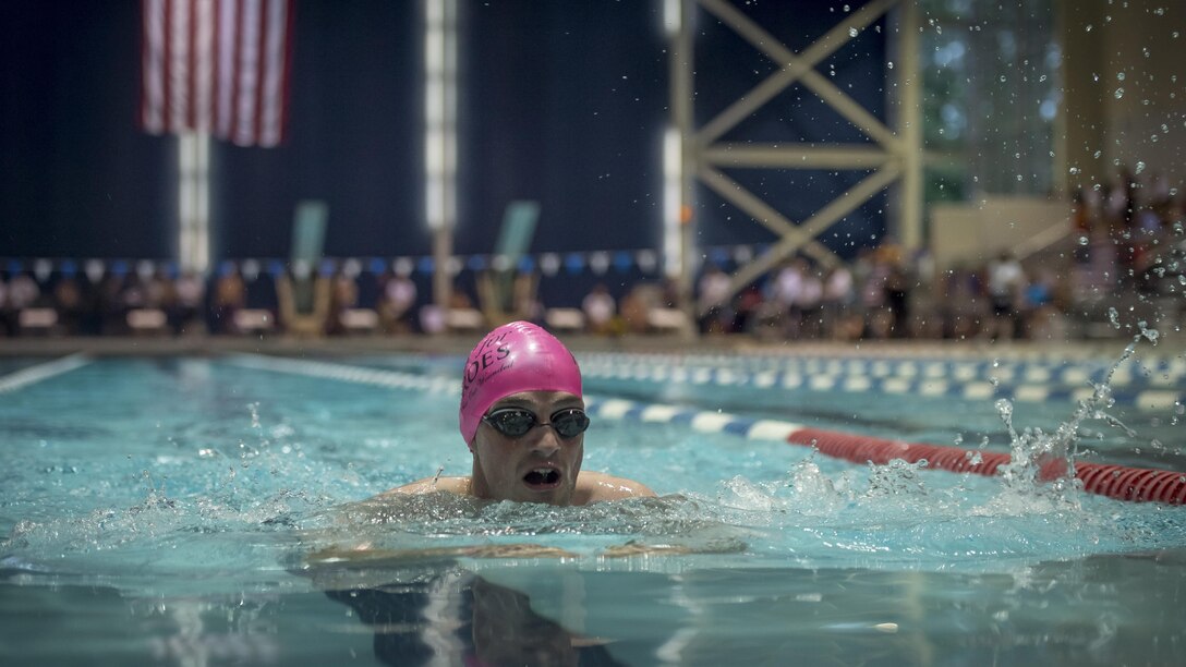 Teams with the 2015 Department of Defense Warrior Games compete against each other in the swimming competition at Freedom Aquatics, Manassas, Virginia, June 27, 2015. The Warrior Games, founded in 2010, is a Paralympic-style competition that features eight adaptive sports for wounded, ill, and injured service members and veterans from the U.S. Army, Marine Corps, Navy/Coast Guard, Air Force, Special Operations Command, and the British Armed Forces. This year marks the first time the DoD takes responsibility for operational planning and coordination of the event, in which approximately 250 athletes are expected to compete.