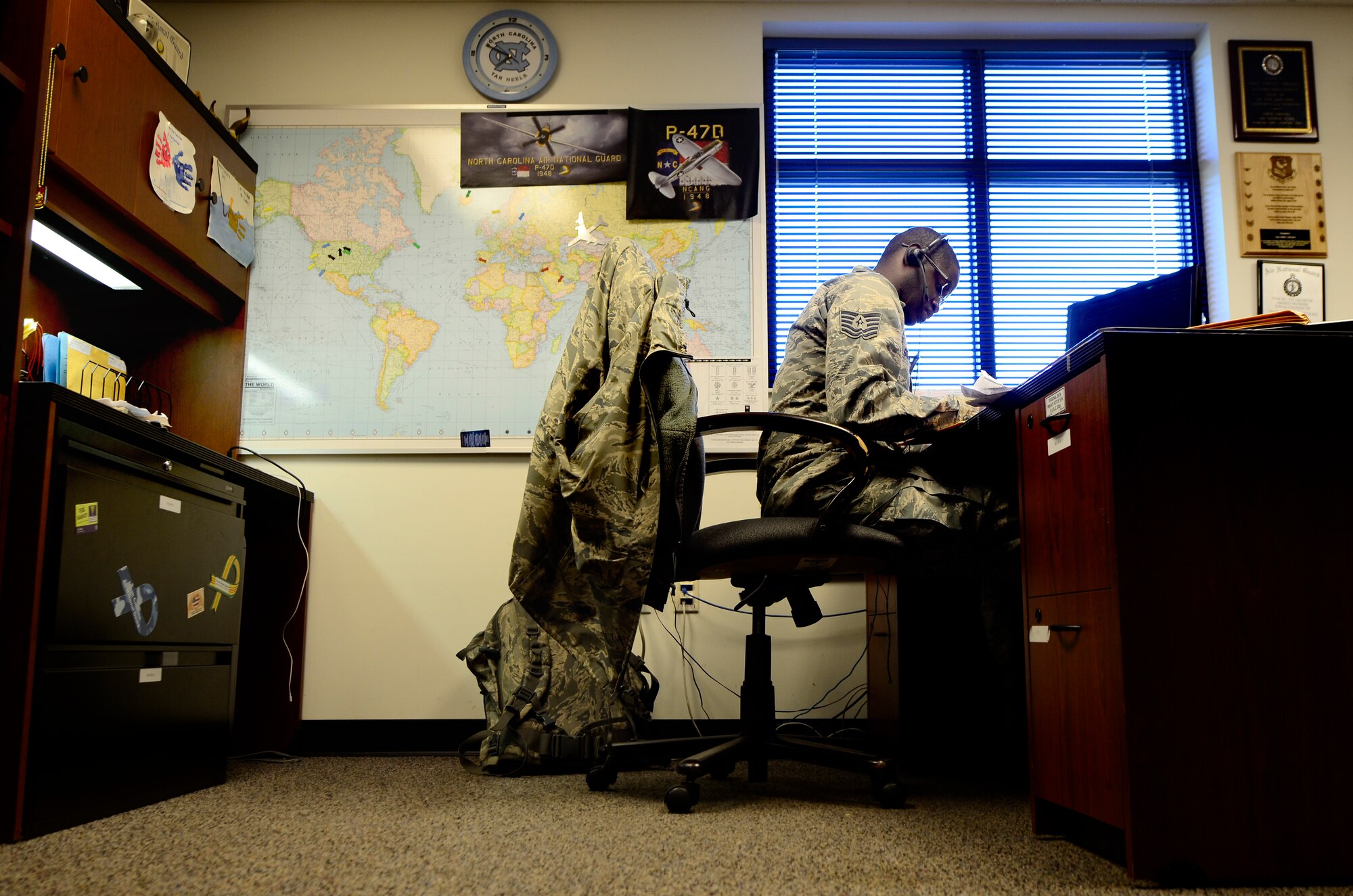 U.S. Air Force Tech. Sgt. Lonnie Brooks, 145th Force Support Squadron production recruiter, responds to e-mails and makes phone calls to potential applicants at the North Carolina Air National Guard base, Charlotte Douglas International Airport, N.C., June 16, 2015. At the age of 18, Brooks enlisted into the NCANG as an aircraft electrician then volunteered for a recruiter position which he has been in for the past six years. Recruiting is Brooks’ way to give back to the Air Force. (U.S. Air National Guard photo by Staff Sgt. Julianne M. Showalter, 145th Public Affairs/Released)