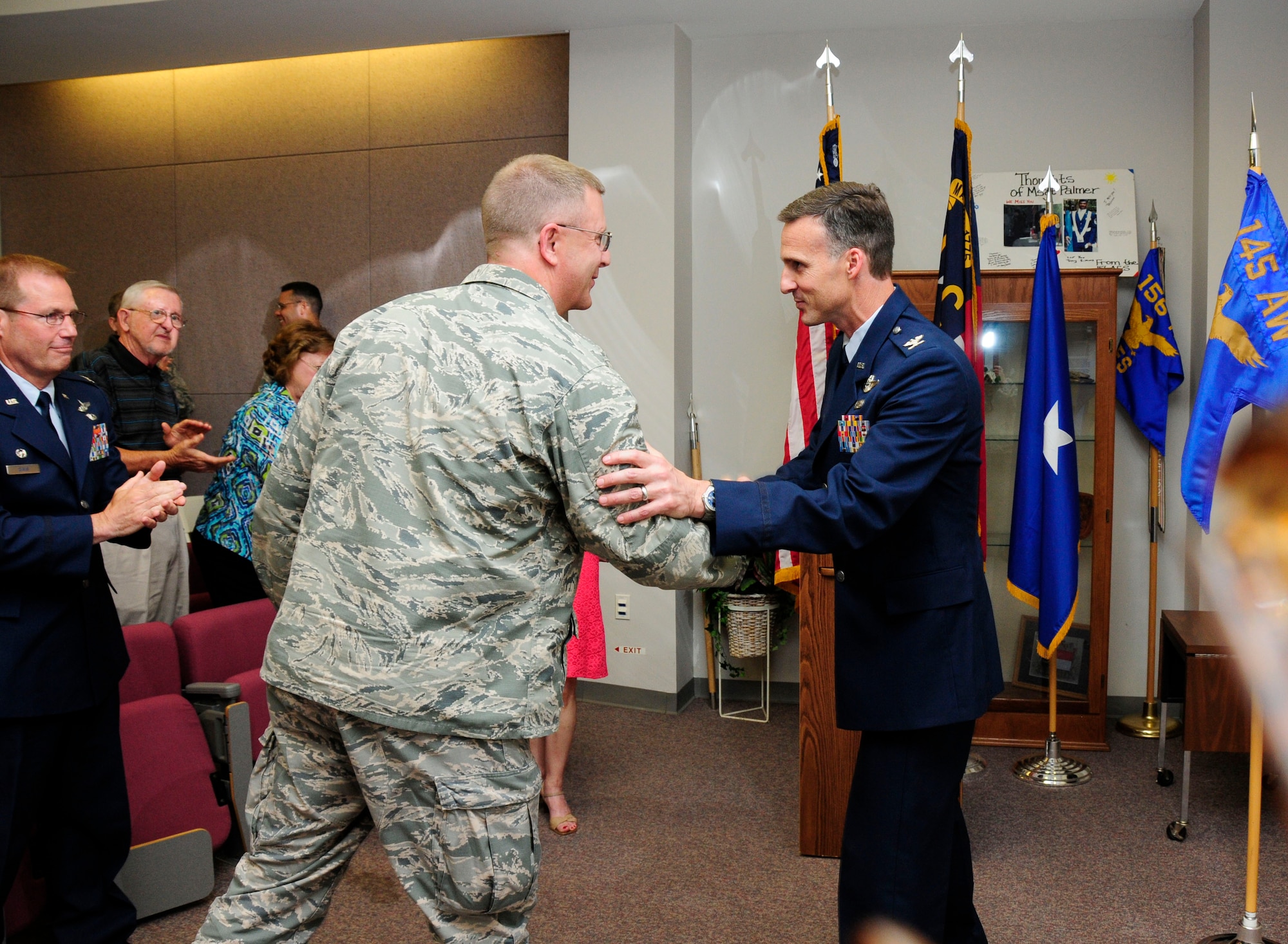 After assuming command of the 145th Operations Group, U.S. Air Force Col. Joseph H. Stepp IV is congratulated by Brig. Gen. Roger E. Williams, Jr., Assistant Adjutant General – Air, during a change of command ceremony held at the North Carolina Air National Guard Base, Charlotte Douglas International Airport; June 6, 2015. (U.S. Air National Guard photo by Master Sgt. Patricia F. Moran, 145th Public Affairs/Released)