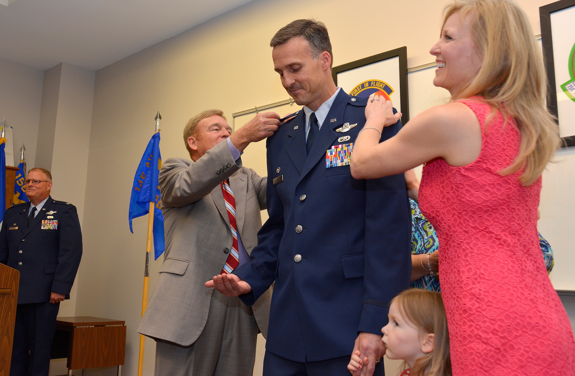 U.S. Air Force Lt. Col. Joseph H. Stepp IV, is pinned to the rank of colonel during a promotion ceremony held in his honor at the North Carolina Air National Guard Base, Charlotte Douglas International Airport, June 6, 2015. Stepp’s father and wife had the honor of removing the oak-leafed, lieutenant colonel rank from his uniform and replacing it with an eagle with outstretched wings – the insignia for colonel. (U.S. Air National Guard photo by Senior Airman Laura Montgomery, 145th Public Affairs/Released)