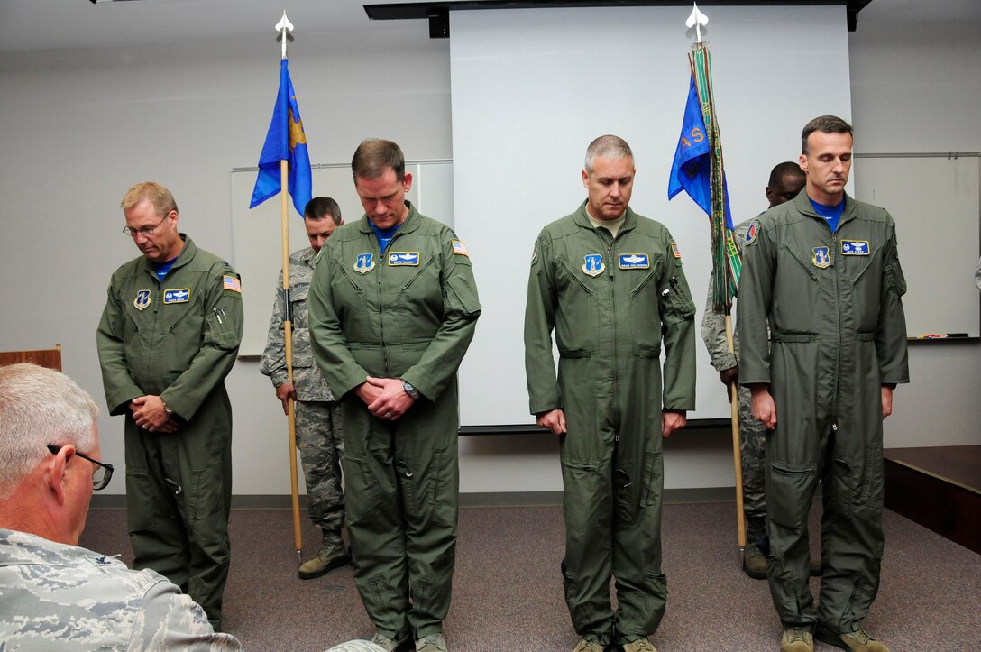 Leaders of the 145th Operations Group, bow their heads in prayer before a change of command ceremony  held at the North Carolina Air National Guard Base, Charlotte Douglas International Airport; June 6, 2015. (U.S. Air National Guard photo by Master Sgt. Patricia F. Moran, 145th Public Affairs/Released)