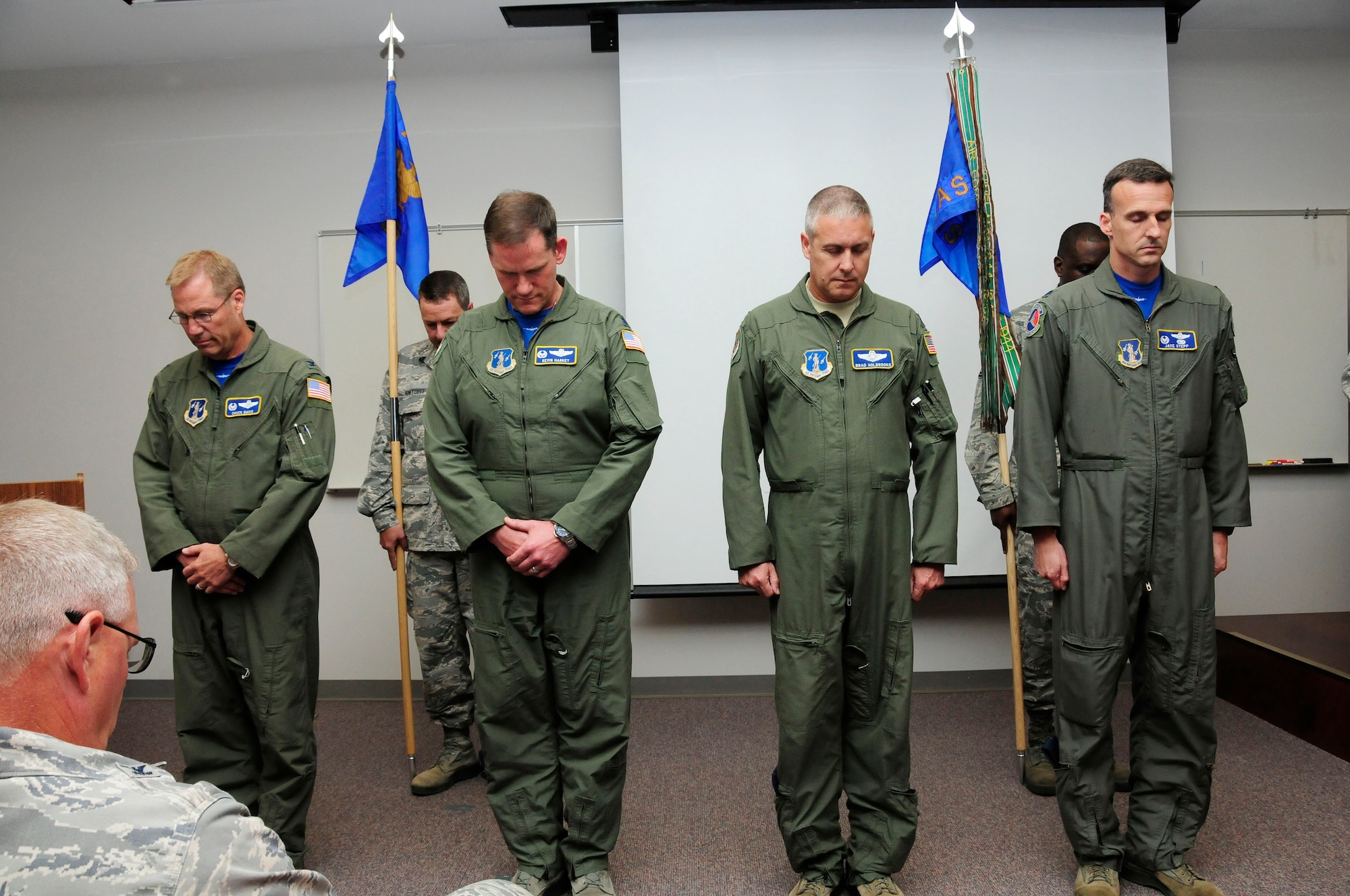 Leaders of the 145th Operations Group, bow their heads in prayer before a change of command ceremony  held at the North Carolina Air National Guard Base, Charlotte Douglas International Airport; June 6, 2015. (U.S. Air National Guard photo by Master Sgt. Patricia F. Moran, 145th Public Affairs/Released)