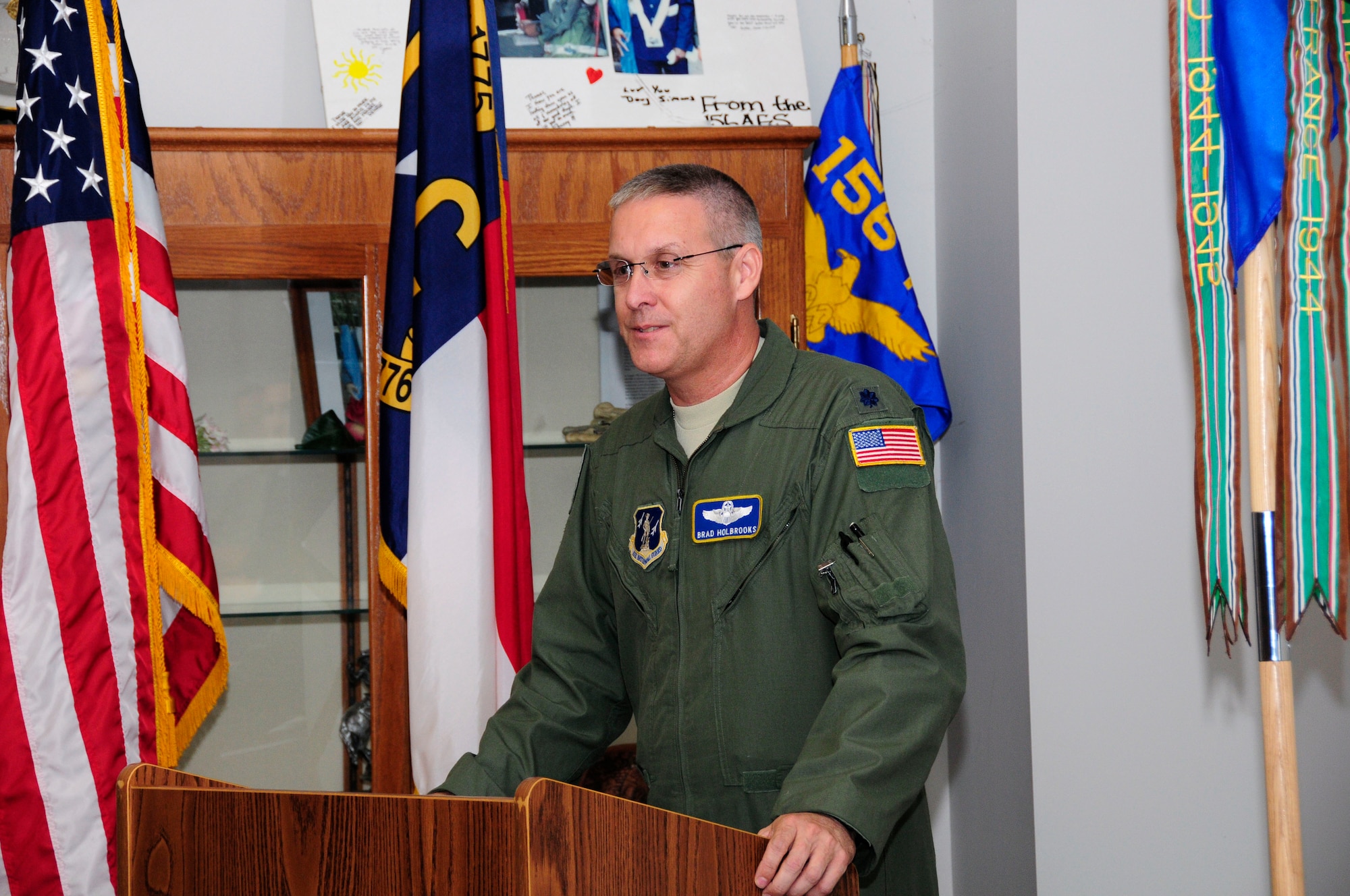 U.S. Air Force Lt. Col. Bradley E. Holbrooks, speaks to members of the North Carolina Air National Guard for the first time as commander of the 145th Operations Support Squadron. Holbrooks took command during a change of command ceremony held at the North Carolina Air National Guard base, Charlotte Douglas International Airport, June 6, 2015. (U.S. Air National Guard photo by Master Sgt. Patricia F. Moran, 145th Public Affairs/Released) 