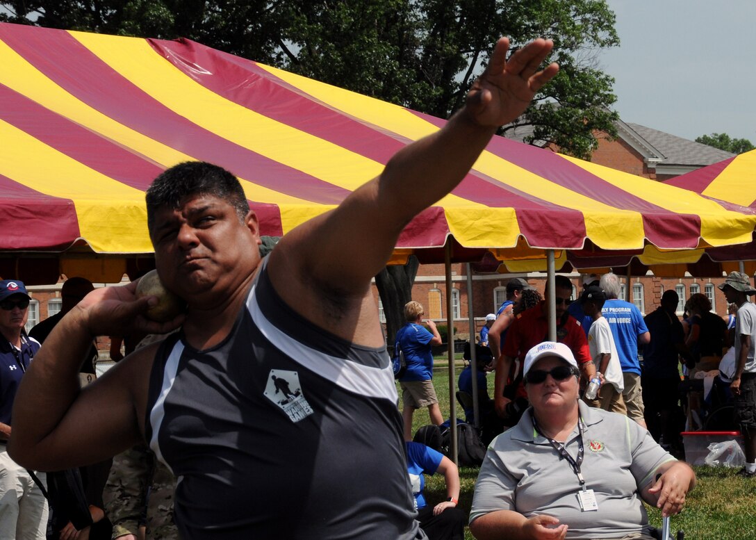 U.S. Special Operations Command veteran retired Army Staff Sgt. Roy Rodriguez throws the seated shot put during the 2015 DoD Warrior Games at Marine Corps Base Quantico, Va., June 23, 2015. DoD photo by Shannon Collins