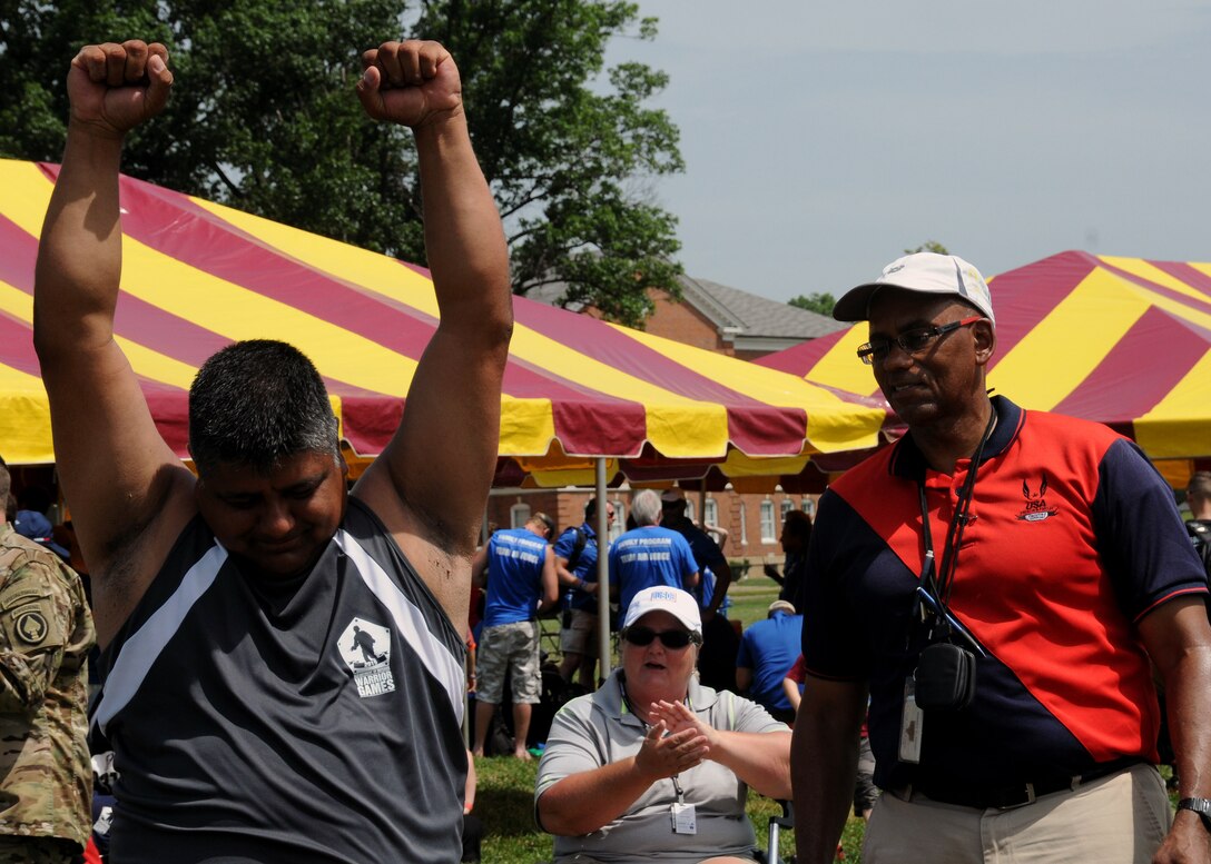 U.S. Special Operations Command veteran retired Army Staff Sgt. Roy Rodriguez celebrates finishing his seated shot put throws during the 2015 DoD Warrior Games at Marine Corps Base Quantico, Va., June 23, 2015. DoD photo by Shannon Collins