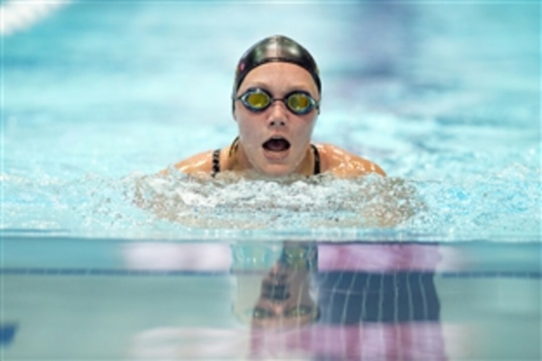 Army Reservist Chasity Kuczer comes up for air while competing in the breaststroke event during the 2015 Department of Defense Warrior Games in Manassas, Va., June 27, 2015.