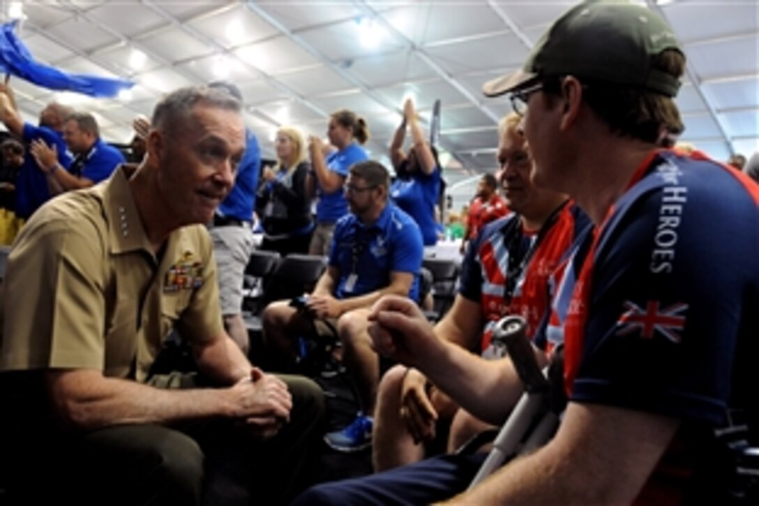 Gen. Joseph F. Dunford, Jr., Commandant of the Marine Corps, talks to British Forces medically retired Maj. David Dent and Lance Cpl. Mark Martin-Davy before the medal presentation for the shooting competition during the 2015 DoD Warrior Games on Marine Corps Base Quantico, Va., June 26, 2015.