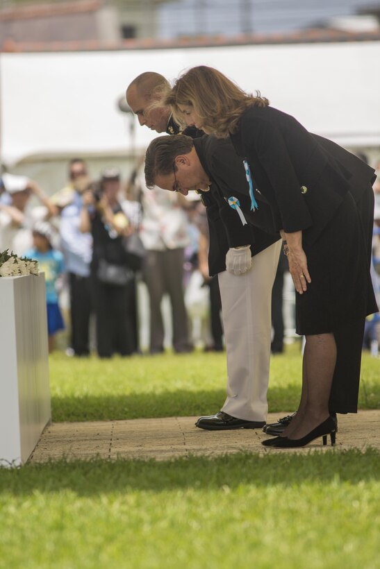 U.S. Ambassador to Japan, Caroline Kennedy; U.S. Consul General, Alfred R. Magelby; and   Commanding General of Marine Corps Installations Pacific, Brig. Gen. Joaquin F. Malavet bow after placing flowers on the memorial during the remembrance ceremony June 23 at the Okinawa Peace Memorial Park. The ceremony was held on the 70th anniversary of the end of the Battle of Okinawa and brought approximately 5,400 people from Okinawa and other prefectures. Honored guests included Prime Minister of Japan, Shinzo Abe; Governor of Okinawa Prefecture, Takeshi Onaga; and the Deputy Commanding General United States Forces Japan, Brig. Gen. Mark R. Wise among others. During the ceremony there was a minute-long moment of silence at noon along with flowers brought to the front and placed on the memorial to honor the dead. Abe and Onaga also gave speaches expressing their grief and sorrow over the nearly 200,000 lives lost during the battle.
