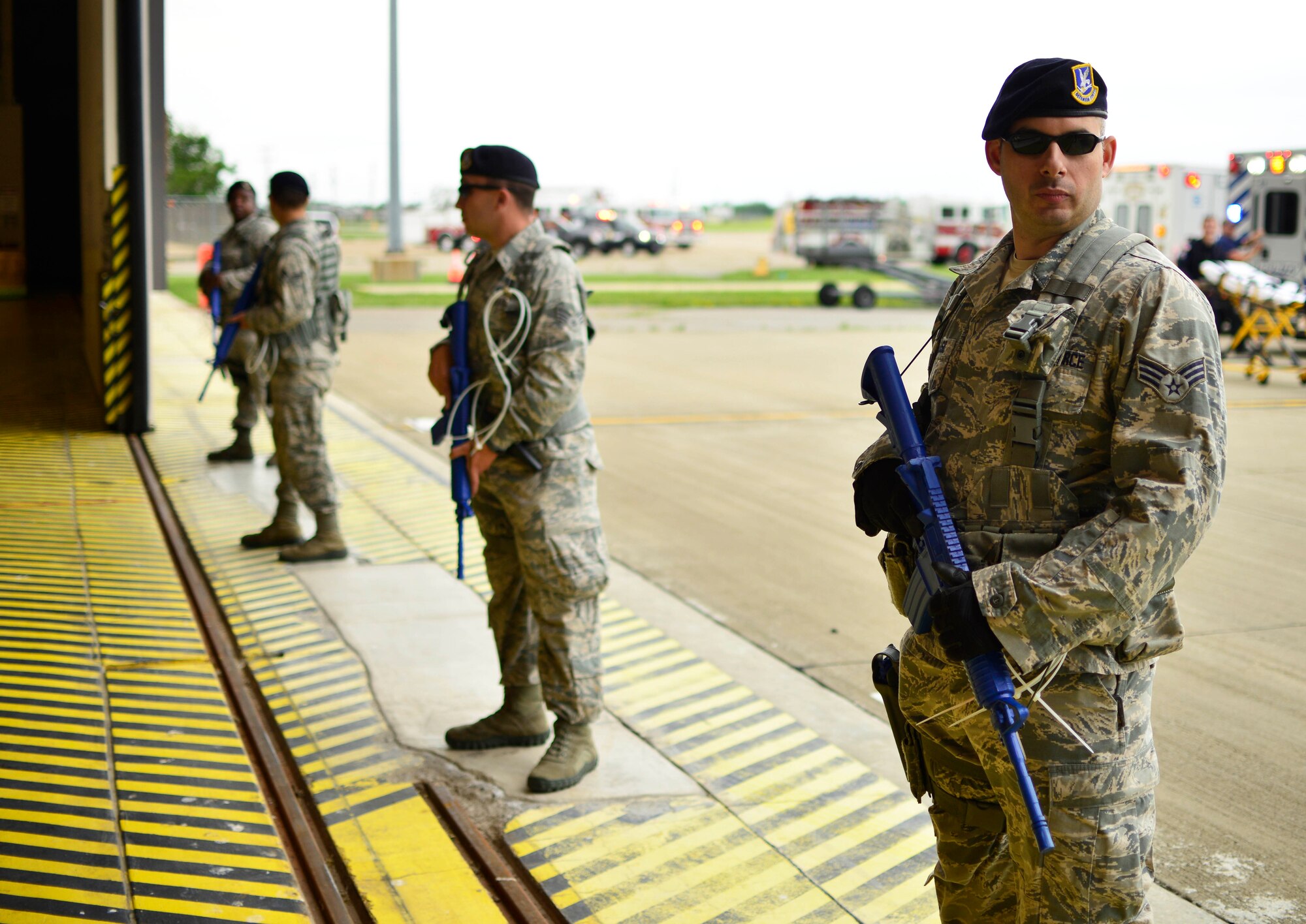 Members of the 914th Security Forces Squadron establish a cordon during the MARE (Major Accident Response Exercise) in order to keep unauthorized personnel from accessing the scene of a simulated C-130 Aircraft incident, June 27, 2015, Niagara Falls Air Reserve Station, N.Y. The MARE is an important part of keeping Niagara’s team ready to respond in an emergency situation. (U.S. Air Force photo by Tech. Sgt. Stephanie Sawyer) 