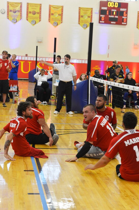 U.S. Marines celebrate a point during the sitting volleyball playoffs