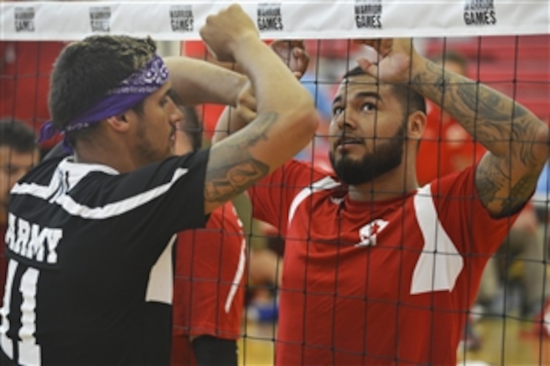 Athletes with Team Army and Team Marines compete in the sitting volleyball playoffs for the 2015 Department of Defense Warrior Games at Barber Physical Activity Center, Marine Corps Base Quantico, Va., June 27, 2015. 