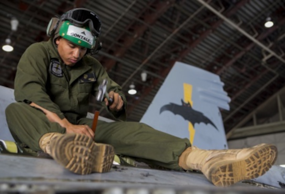 U.S. Marine Corps Lance Cpl. Emanuel Gonzalez, an airframes mechanic with the Marine All-Weather Fighter Attack Squadron (VMFA [AW]) 242, 1st Marine Aircraft Wing, removes old sealant on a U.S. Marine Corps FA-18D Hornet assigned to VMFA (AW)-242 during Exercise Northern Edge 15 at Eielson Air Force Base, Alaska, June 22, 2015. Northern Edge is Alaska’s premier joint training exercise designed to practice operations, techniques and procedures as well as enhance interoperability among the services. Thousands of service members from active duty, reserve and National Guard units are involved