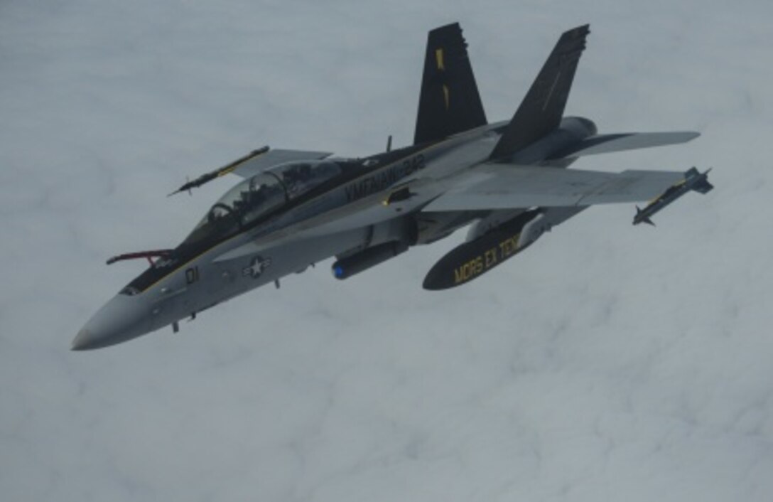 A U.S. Marine Corps F/A-18D Hornet aircraft, assigned to the Marine All-Weather Fighter Attack Squadron 242, 1st Marine Aircraft Wing, flies over the Gulf of Alaska, June 22, 2015. The aircraft was being refueled while flying a training mission during Exercise Northern Edge 15. Northern Edge is Alaska’s premier joint training exercise designed to practice operations, techniques and procedures as well as enhance interoperability among the services. Thousands of Airmen, Soldiers, Sailors, Marines and Coast Guardsmen from active duty, reserve and National Guard units are involved