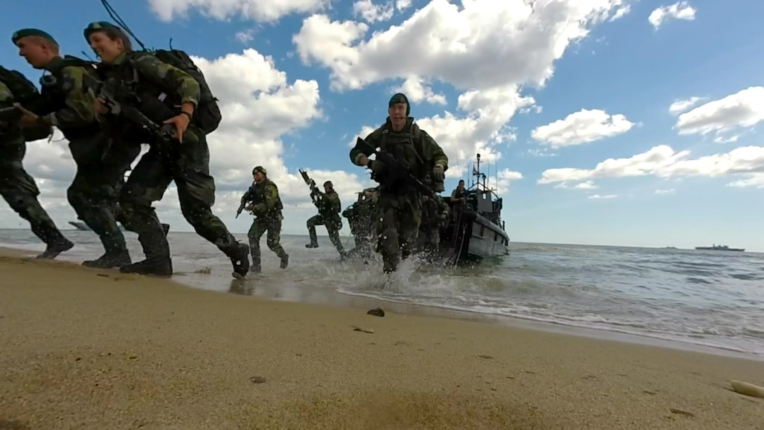 NATO Response Force and Allied Marines from the U.K., U.S., Sweden, and Finland simulate amphibious assaults on a Swedish beachhead during BALTOPS 2015, June 10. The 17 Allied and partner countries will integrate their air, land, and sea operations and procedures to demonstrate the combined-forces capability to respond to threats in the Baltic region.