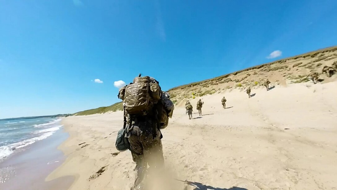 NATO Response Force and Allied Marines from the U.K., U.S., Sweden, and Finland simulate amphibious assaults on a Swedish beachhead during BALTOPS 2015, June 10. The 17 Allied and partner countries will integrate their air, land, and sea operations and procedures to demonstrate the combined-forces capability to respond to threats in the Baltic region.
