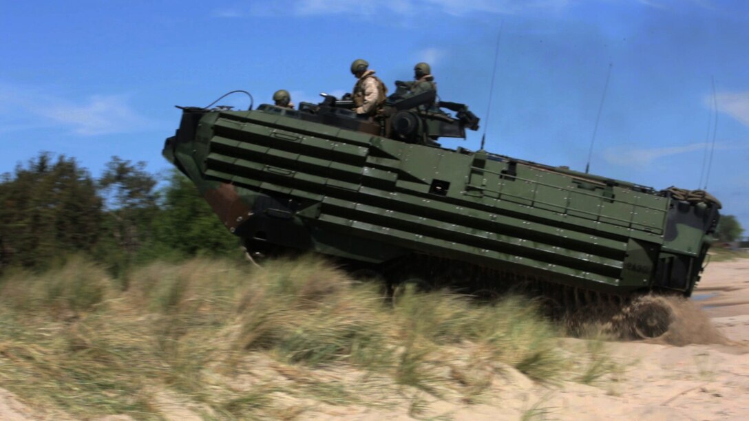 A U.S. Marine Amphibious Assault Vehicle tracks up a Swedish beachhead while practicing ship-to-shore landings with Swedish, Finnish and British Marines during BALTOPS 2015, June 11. BALTOPS is an annual, multinational exercise designed to enhance the operational familiarity of NATO Allies and partner nations and demonstrate the capabilities to defend against and defeat threats in the Baltic region.