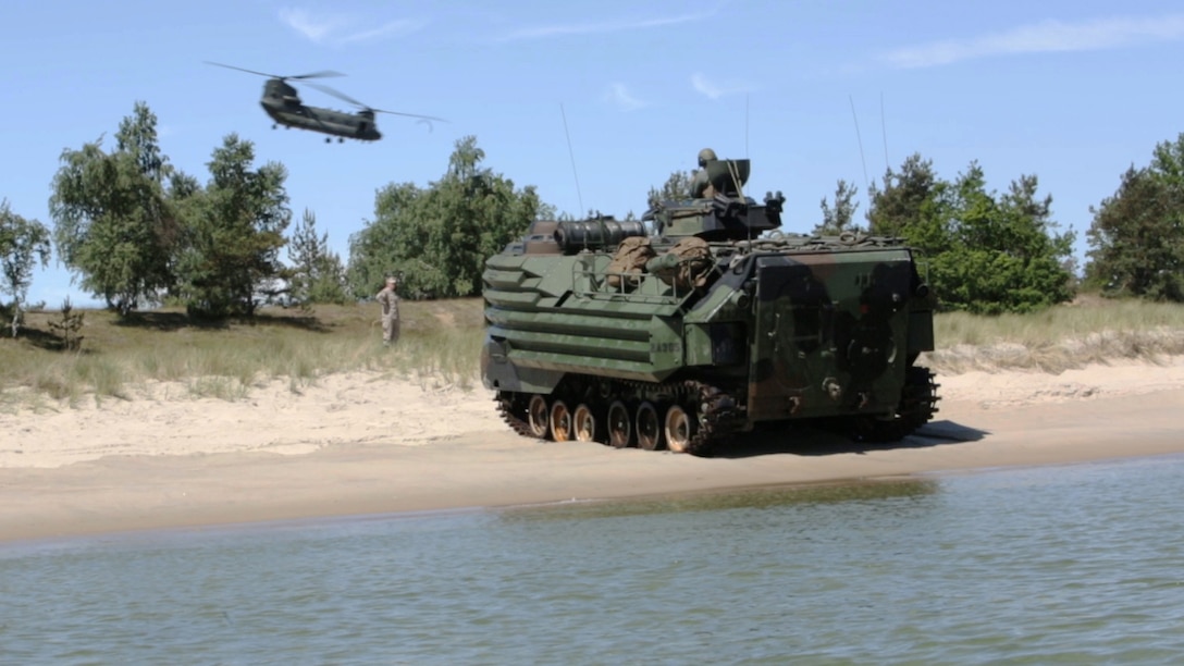 Swedish, British, Finnish and U.S. Marines simulate ship-to-shore landings with their amphibious assault vehicles on a beachhead in Sweden during BALTOPS 2015, June 11.  Seventeen NATO and partner nations participate in the 43rd iteration of the multinational maritime exercise BALTOPS 2015 in Poland, Sweden, Germany, and throughout the Baltic Sea, June 5-20, 2015.