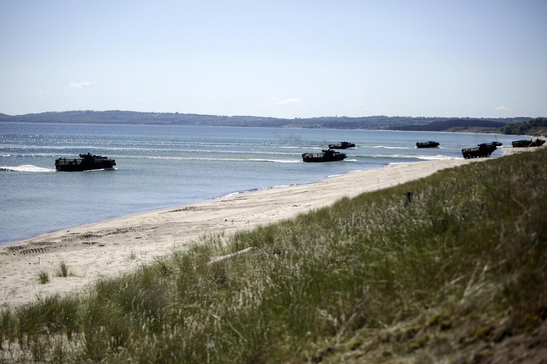 Marines with Charlie Company, 1st Battalion, 6th Marine Regiment ride in amphibious assault vehicles as they splashed onto a beach in Sweden for a two-day training operation during BALTOPS 2015 June 11, 2015. Marine Corps from Sweden, Finland, the U.K. and U.S. made up the amphibious assault force during BALTOPS 2015, an annual exercise with 17 NATO and partner nations. (U.S. Marine Corps photo by Cpl. Alexander Mitchell/released)