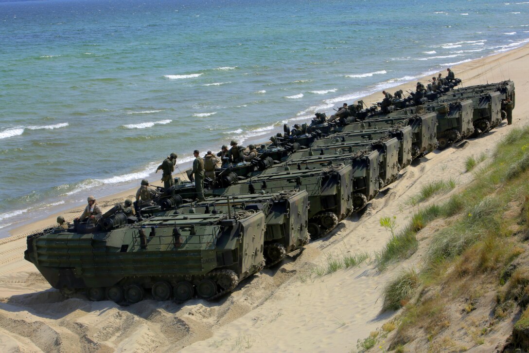 An international Corps of Marines from Sweden, Finland, and the U.K. conduct amphibious assaults on a beachhead in Ravlunda, Sweden, for local media outlets during BALTOPS 2015, June 13. The amphibious forces are part of 17 NATO Allies and partner nations that are integrated in air, land, and sea operations to improve their combined-force capability to work together and to respond to threats in the Baltic region.