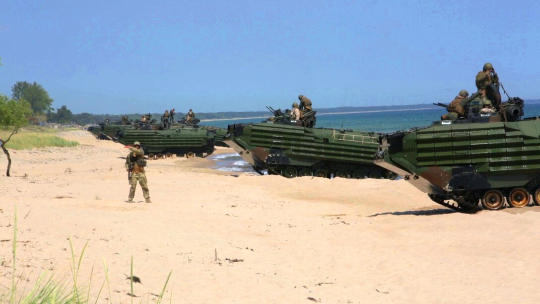 An international Corps of Marines from Sweden, Finland, and the U.K. conduct amphibious assaults on a beachhead in Ravlunda, Sweden, for local media outlets during BALTOPS 2015, June 13. The amphibious forces are part of 17 NATO Allies and partner nations that are integrated in air, land, and sea operations to improve their combined-force capability to work together and to respond to threats in the Baltic region.