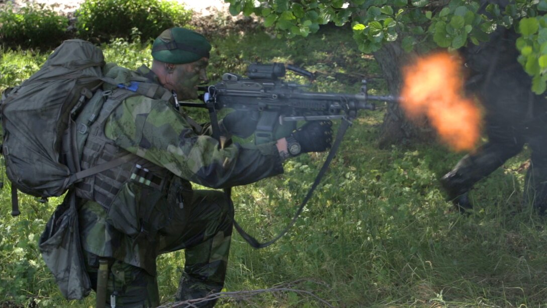 An international Corps of Marines from Sweden, Finland, and the U.K. conduct amphibious assaults on a beachhead in Ravlunda, Sweden, for local media outlets during BALTOPS 2015, June 13. The amphibious forces are part of 17 NATO Allies and partner nations that are integrated in air, land, and sea operations to improve their combined-force capability to work together and to respond to threats in the Baltic region.