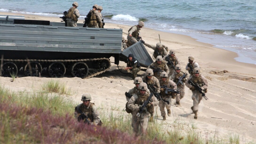 An international Corps of Marines from Sweden, Finland, and the U.K. conduct amphibious assaults on a beachhead in Ravlunda, Sweden, for local media outlets during BALTOPS 2015, June 13. The amphibious forces are part of 17 NATO Allies and partner nations that are integrated in air, land, and sea operations to improve their combined-force capability to work together and to respond to threats in the Baltic region.