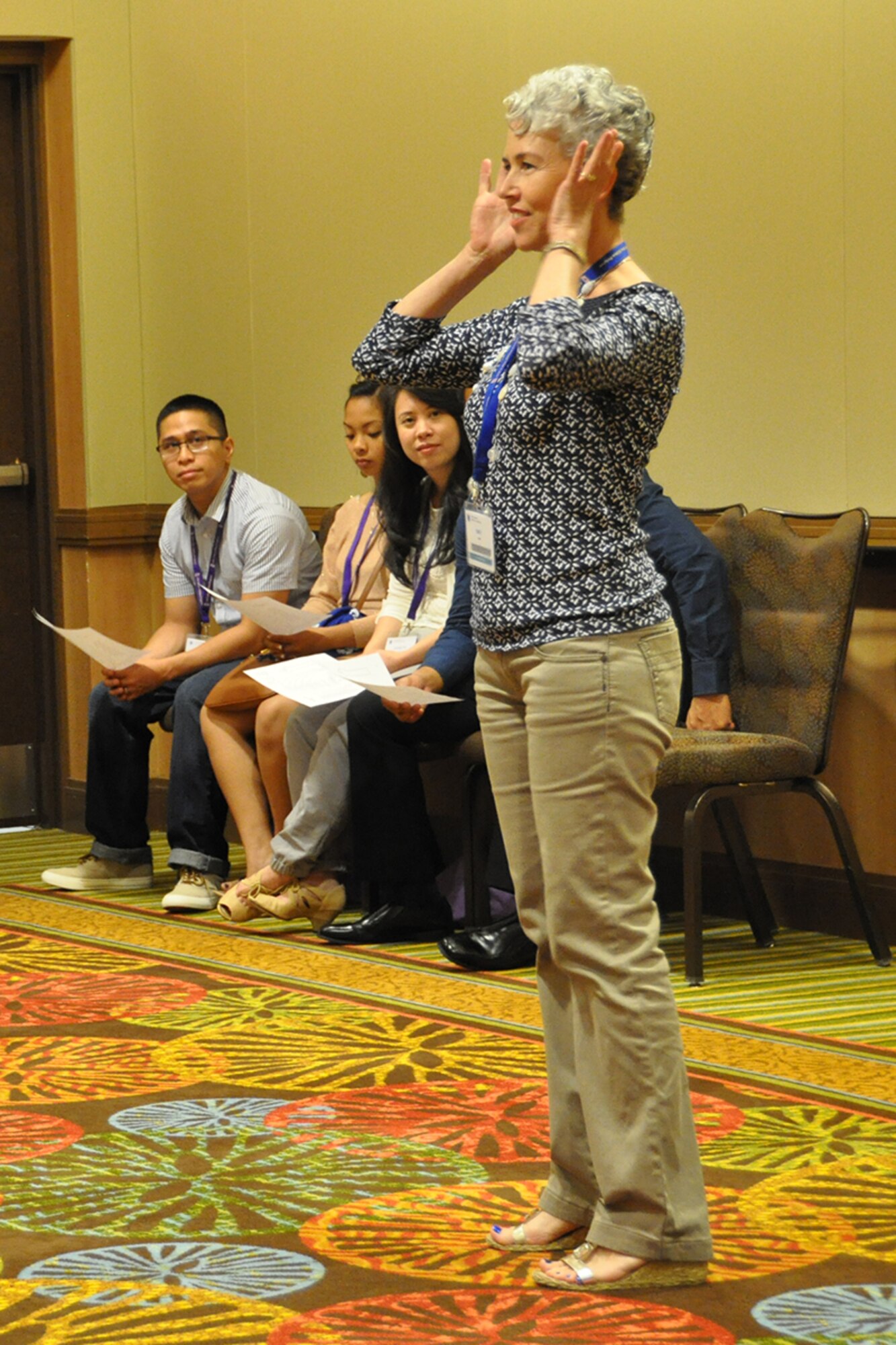 Emily Hain, Integrative Restoration and yoga instructor, instructs Air Force Reserve members and their families June 27, 2015, during a breakout session at an Air Force Reserve Yellow Ribbon Program training event in Orlando, Florida. Yellow Ribbon promotes the well-being of reservists and their families by connecting them with resources before and after deployments. (U.S Air Force photo/Master Sgt. James Branch)