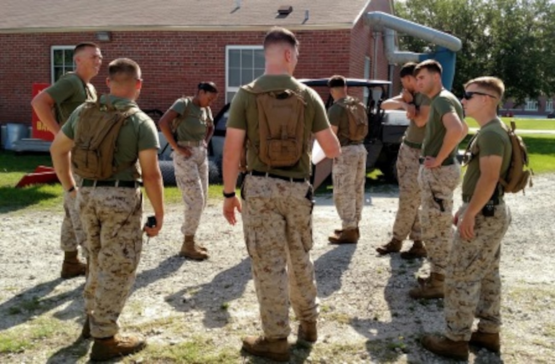 16 Jun 2015 - Staff Sergeant Matthew S. Lewis and the squad leaders, comprised of Noncommissioned Officers from Weapons Training Battalion prepare to lead the Lejeune High School MJROTC Cadets through the Stamina Course aboard Stone Bay.