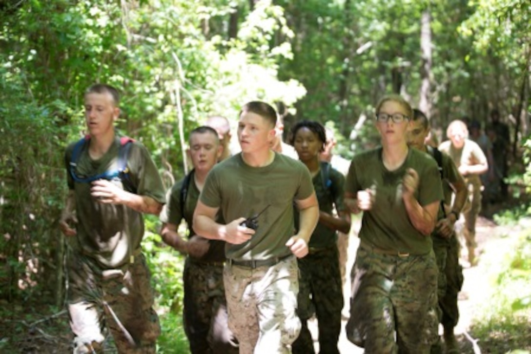 16 Jun 2015 - Corporal Trenton A. Jordan leads a Squad of MJROTC cadets from Lejeune High School’s summer leadership course along the Stone Bay Stamina Course.