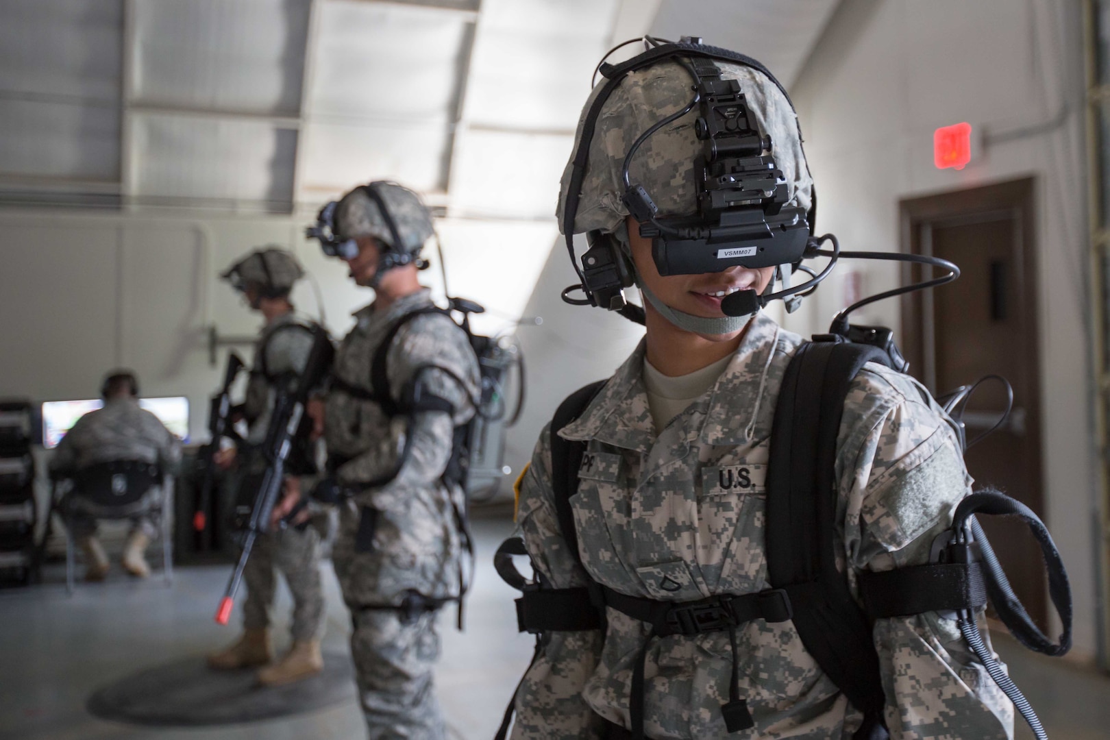 Pfc. Shante Sapp, assigned to Headquarters and Headquarters Company, 35th Engineer Brigade, moves her head to look around in a virtual training simulation using the Dismounted Soldier Training System on June 16, 2015 at Fort Leonard Wood, Missouri. The system uses motion tracking to allow soldiers to train in a simulated deployed environment.
