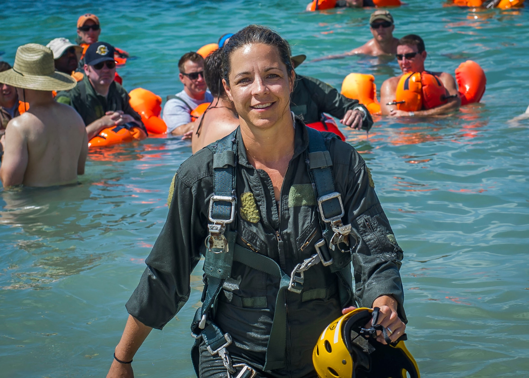 Airmen prepare to conduct a body drag during a water survival exercise June 27, 2015, at Naval Air Station Key West, Fla. More than 90 Airmen from the 300th Airlift Squadron deployed for a mass exercise that involved accomplished more than 500 training tasks. (U.S. Air Force photo by Senior Airman Tom Brading)
