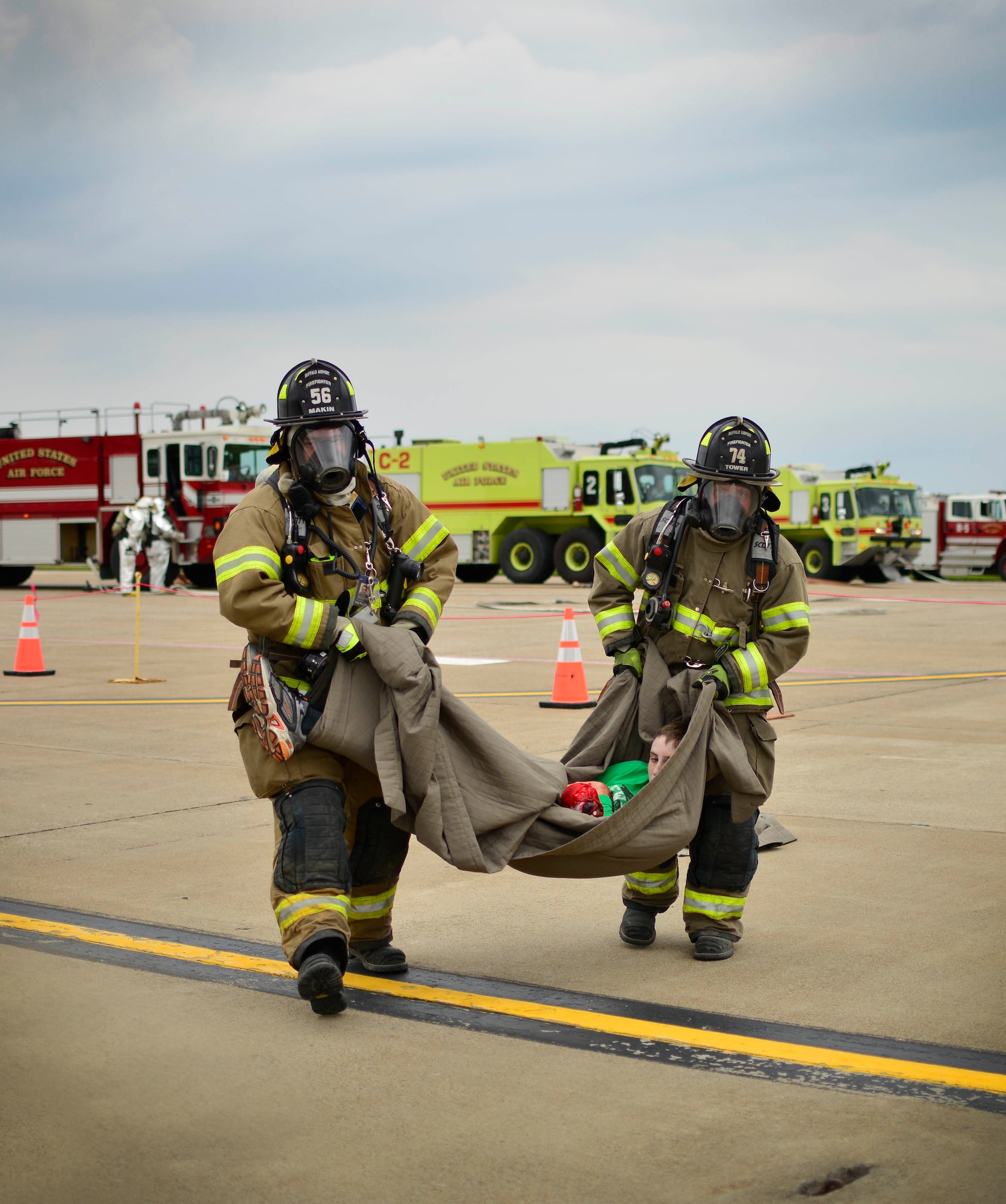 Emergency Response personnel treat victims of a simulated C-130 Aircraft hard landing as part of the Major Accident Response Exercise, June 27, 2015, Niagara Falls Air Reserve Station, N.Y. The MARE is an important part of keeping Niagara’s team ready to respond in an emergency situation. (U.S. Air Force photo by Tech. Sgt. Stephanie Sawyer) 
