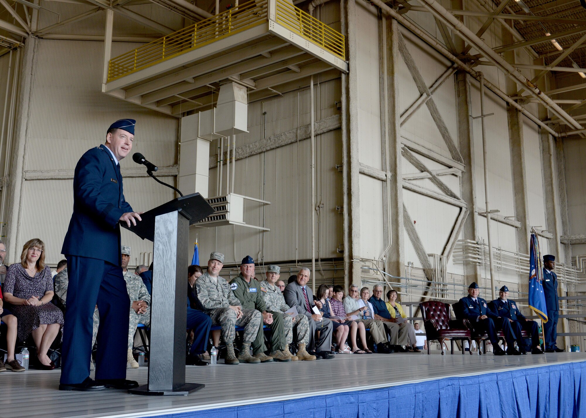 U.S. Air Force Maj. Gen. James Hecker, 19th Air Force commander, presents the 97th Air Mobility Wing guidon to U.S. Air Force Col. Todd Hohn, 97th AMW commander, during the 97th AMW Change of Command Ceremony at Altus Air Force Base, Oklahoma, June 26, 2015. Hohn assumed command as the new wing commander where he will lead the Airmen of the base in supporting the mission of forging combat mobility forces and deploying Airmen warriors. (U.S. Air Force photo by Senior Airman Franklin R. Ramos)