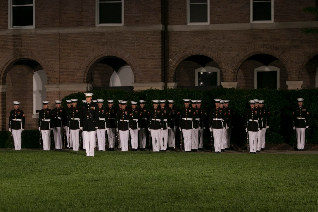 The Marines from Marine Barracks Washington, D.C. perform during the Friday Evening Parade, June 26, 2015.  The Honorable Pete Visclosky, representative, 1st District of Indiana, and the Honorable Rodney P. Frelinghuysen, representative, 11th district of New Jersey, were the guests of honor at the Evening Parade, and Lt. Gen. Glenn M. Walters, deputy commandant for programs and resources, was the hosting official for that same parade. (Official Marine Corps photo by Cpl. Christian Varney/Released)