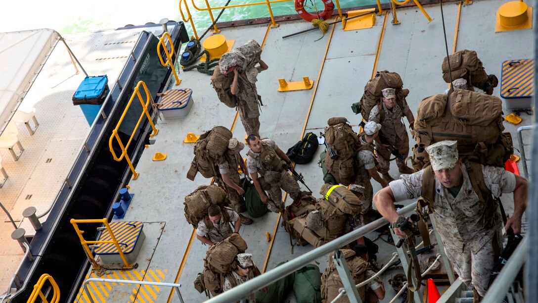 U.S. Marine Corps Sgt. Dylan Hudson, a squad leader with Company A, 1st Battalion, 4th Marine Regiment, Marine Rotational Force – Darwin, embarks on the USNS Sacagawea June 17, 2015 to depart Darwin, Northern Territory, Australia for Exercise Koa Moana 15.2 in East Timor. A platoon of Marines will be conducting a bilateral exercise with the East Timor Defence Force, focusing on individual-level fundamentals to build proficiency in complex squad and platoon level tasks. The bilateral training will include room clearing of buildings, urban movement and patrolling. The MRF-D six-month deployment demonstrates how the Marine Air Ground Task Force is equipped and organized to carry out national objectives in cooperation with our national and international partners. Hudson is a native of Seaford, Delaware.