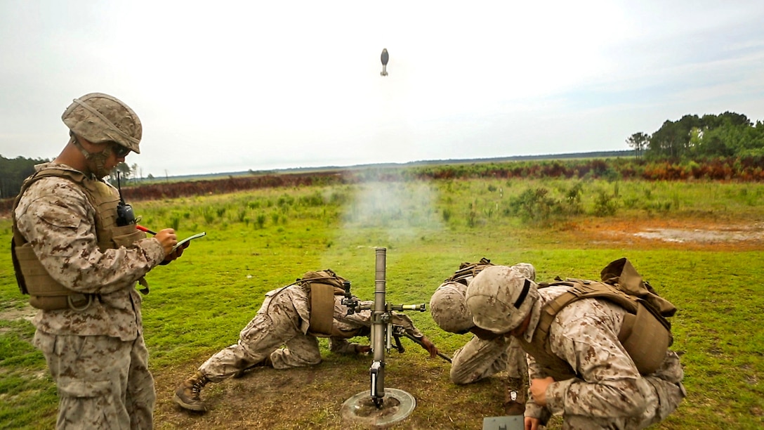 Marines with 2nd Battalion, 2nd Marine Regiment fire a 60mm mortar during a live-fire exercise at Marine Corps Base Camp Lejeune, North Carolina, June 25, 2015.  The unit conducted the training to better prepare the Marines for the use of the direct lay method of fire.  The direct lay method requires the Marines to make all their adjustments themselves and not rely on a Fire Direction Center. 