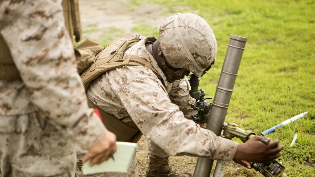 Marines with 2nd Battalion, 2nd Marine Regiment learn how to make adjustments on the 61mm mortar system at a live-fire range at Marine Corps Base Camp Lejeune, North Carolina, June 25, 2015.  The exercise allowed Marines new to the unit to gain knowledge and experience with both 61mm and 80 mm mortal systems.