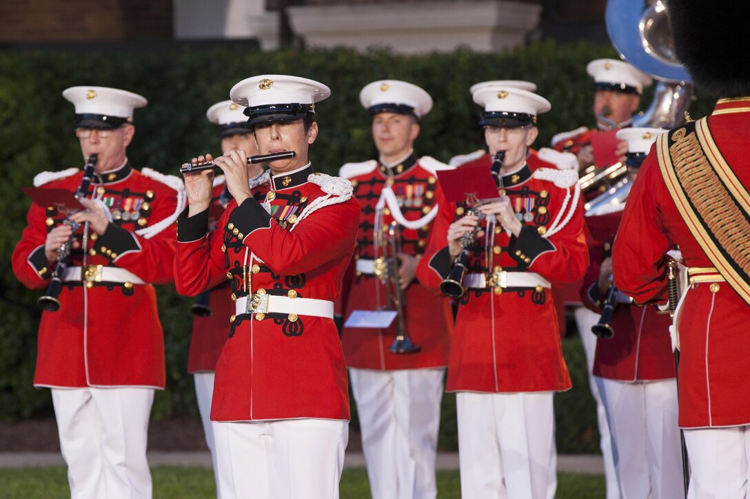 The U.S. Marine Band performs during an evening parade at Marine Barracks Washington, D.C., June 29, 2015. The Honorable Mr. Pete Visclosky and The Honorable Mr. Rodney P. Frelinghuysen were the guests of honor for the parade and Lt. Gen. Glenn M. Walters was the hosting official for that same parade.  The Evening Parade summer tradition began in 1934 and features the Silent Drill Platoon, the U.S. Marine Band, the U.S. Marine Drum and Bugle Corps and two marching companies. More than 3,500 guests attend the parade every week. (U.S. Marine Corps photo by Lance Cpl. Kayla V. McTaw)
