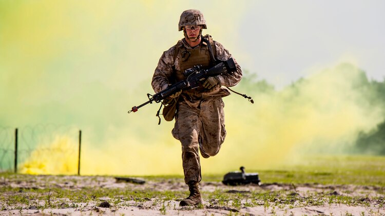 Lance Cpl. Alex Rowan, a combat engineer with 4th Combat Engineer Battalion, 4th Marine Division, stationed out of Bessemer, Alabama, runs to take cover before the Anti-Personnel Obstacle Breaching System detonates during the SAPPER Leaders Course at Marine Corps Base Camp Lejeune, North Carolina, June 26, 2015. During the course, the Marines used assault and breaching techniques to clear a wire obstacle using line charges that utilized C4 explosives and their APOBS. 