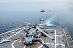 SOUTH CHINA SEA (June 24, 2015) Sailors refuel an MH-60R Sea Hawk helicopter attached to Helicopter Maritime Strike Squadron (HSM) 35 aboard the littoral combat ship USS Fort Worth (LCS 3) during a maneuvering exercise with Philippine navy ships BRP Gregorio del Pilar (PF 15) and BRP Ramon Alcaraz (PF 16) as part of Cooperation Afloat Readiness And Training (CARAT) Philippines 2015. In its 21st year, CARAT is an annual, bilateral exercise series with the U.S. Navy, U.S. Marine Corps and the armed forces of nine partner nations. 