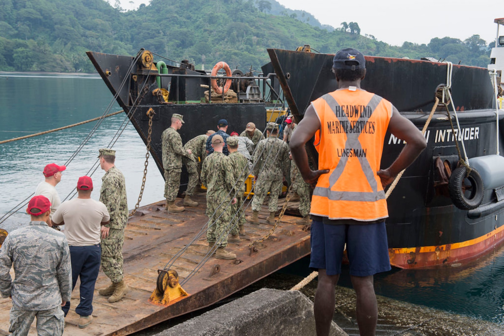 ARAWA, Autonomous Region of Bougainville, Papua New Guinea (June 28, 2015) - A team of Navy Seabees and Air Force REDHORSE engineers unload a ship in preparation for construction operations during Pacific Partnership. The team will refurbish and construct two projects for schools in the Arawa area. The hospital ship USNS Mercy (T-AH 19) is currently in Papua New Guinea for its second mission port of Pacific Partnership 2015. Pacific Partnership is in its tenth iteration and is the largest annual multilateral humanitarian assistance and disaster relief preparedness mission conducted in the Indo-Asia-Pacific region. While training for crisis conditions, Pacific Partnership missions to date have provided real world medical care to approximately 270,000 patients and veterinary services to more than 38,000 animals. Critical infrastructure development has been supported in host nations during more than 180 engineering projects. 