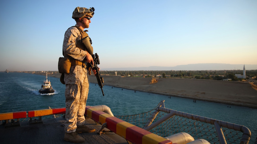Cpl. Chris R. Dalessandro, a low-altitude air defense gunner with Marine Medium Tiltrotor Squadron 365, 24th Marine Expeditionary Unit, provides security while the amphibious assault ship USS Iwo Jima steams through the Suez Canal, June 21, 2015. The 24th MEU and Iwo Jima Amphibious Ready Group transited through the canal, a 120-mile-long waterway connecting the Red Sea to the Mediterranean, and entered the U.S. 6th Fleet area of operations. The 24th MEU is deployed on the ships of the Iwo Jima ARG in support of U.S. national security interests in the U.S. 6th Fleet area of operations.