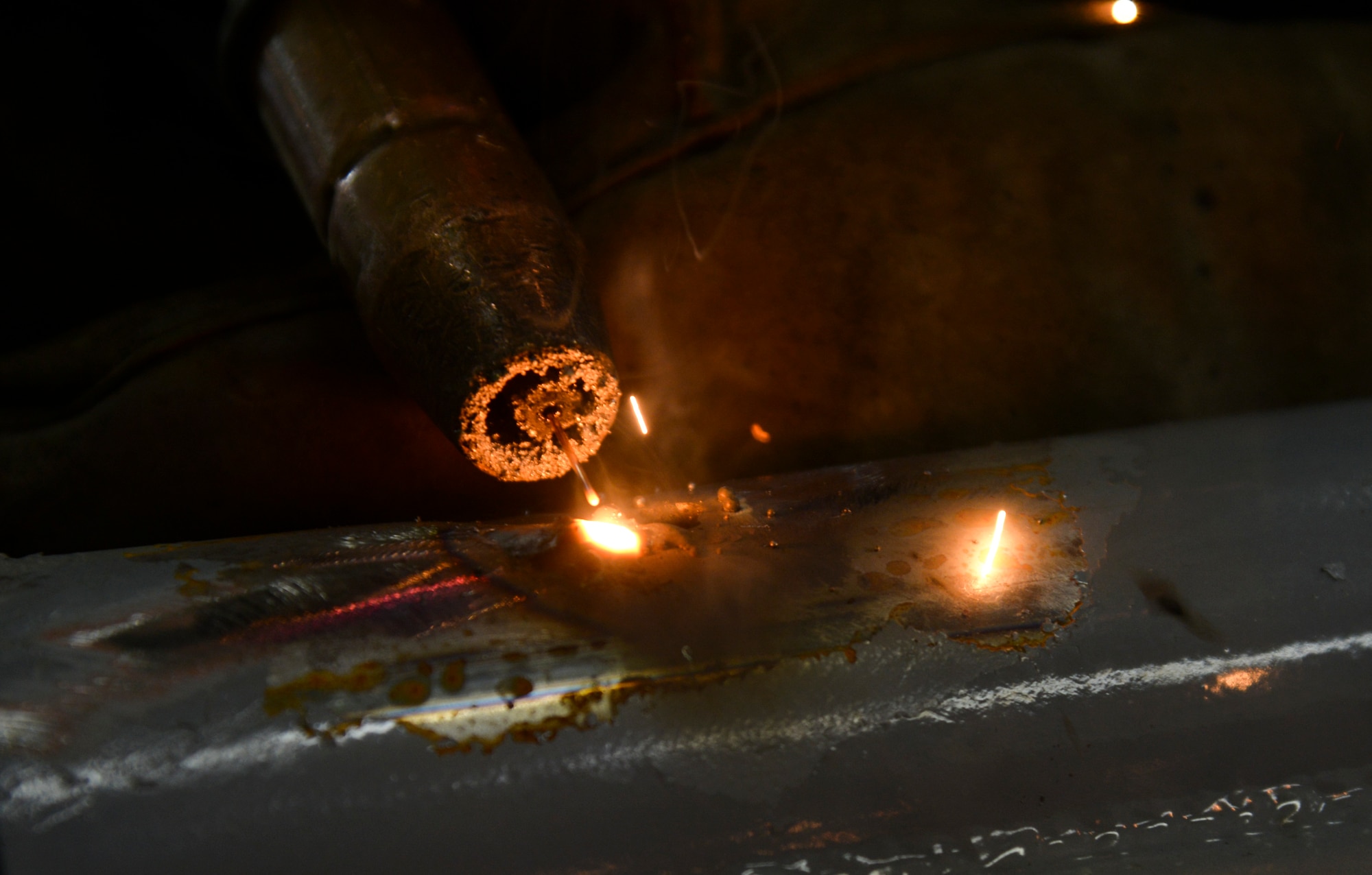 Airman 1st Class Curtis Doherty, a 374th Maintenance Squadron aircraft metals technology journeyman, welds a post hole for a B-1B Lancer platform in the fabrication shop at Yokota Air Base, Japan, June 23, 2015. The metal technology shop works on 20-80 pieces of equipment each week. (U.S. Air Force photo/Senior Airman David Owsianka)