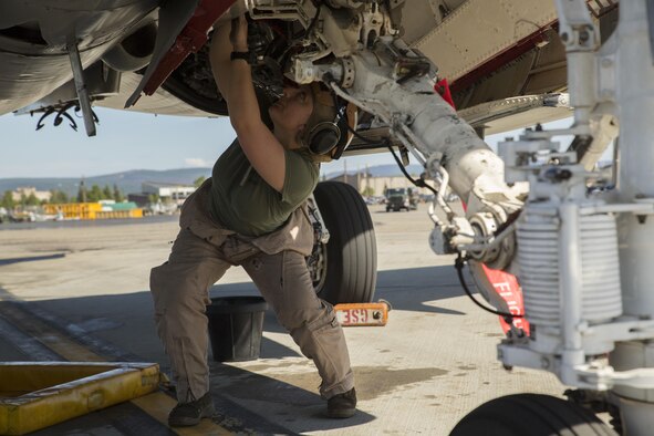 U.S. Marine Corps Lance Cpl. Jessica Kerr, from St. Louis, Missouri, inspects an EA-6B Prowler during Exercise Northern Edge 2015, June 15, 2015 at Eielson Air Force Base, Alaska. The Prowler is an electronic warfare aircraft used to jam radar signals making other military aircraft invisible to radar. NE15 is Alaska’s premier joint training exercise designed to practice operations, techniques and procedures as well as enhance interoperability among the services. Thousands of participants from all of the services, airmen, soldiers, sailors Marines and Coast Guardsmen from active duty, reserve and National Guard Units are involved.  Kerr is a plane captain with Marine Tactical Electronic Warfare Squadron 2, Marine Aircraft Group 14, 2nd Marine Aircraft Wing, II Marine Expeditionary Force. (U.S. Marine Corps photo by Cpl. Thor J. Larson/Released)