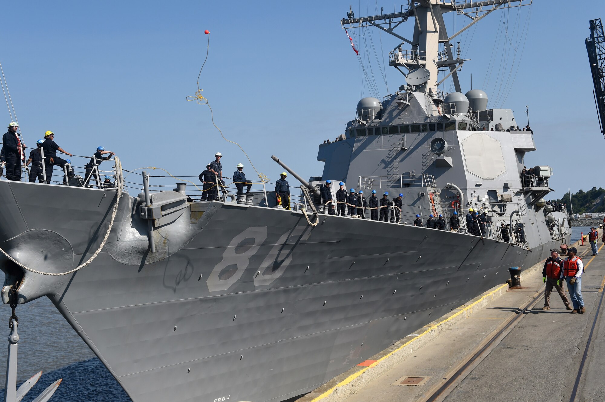 A crew member of the U.S. Navy's USS Shoup (DDG 86) throws a mooring line to a longshoreman at the Port of Anchorage, Alaska, June 24, 2015. The Shoup is one of three U.S. Navy destroyers participating in Exercise Northern Edge out of the Gulf of Alaska. Thousands of service members from all the branch services including active duty, Reserve and National Guard units participated. (U.S. Navy photo by Chief Mass Communication Specialist Larry Foos)