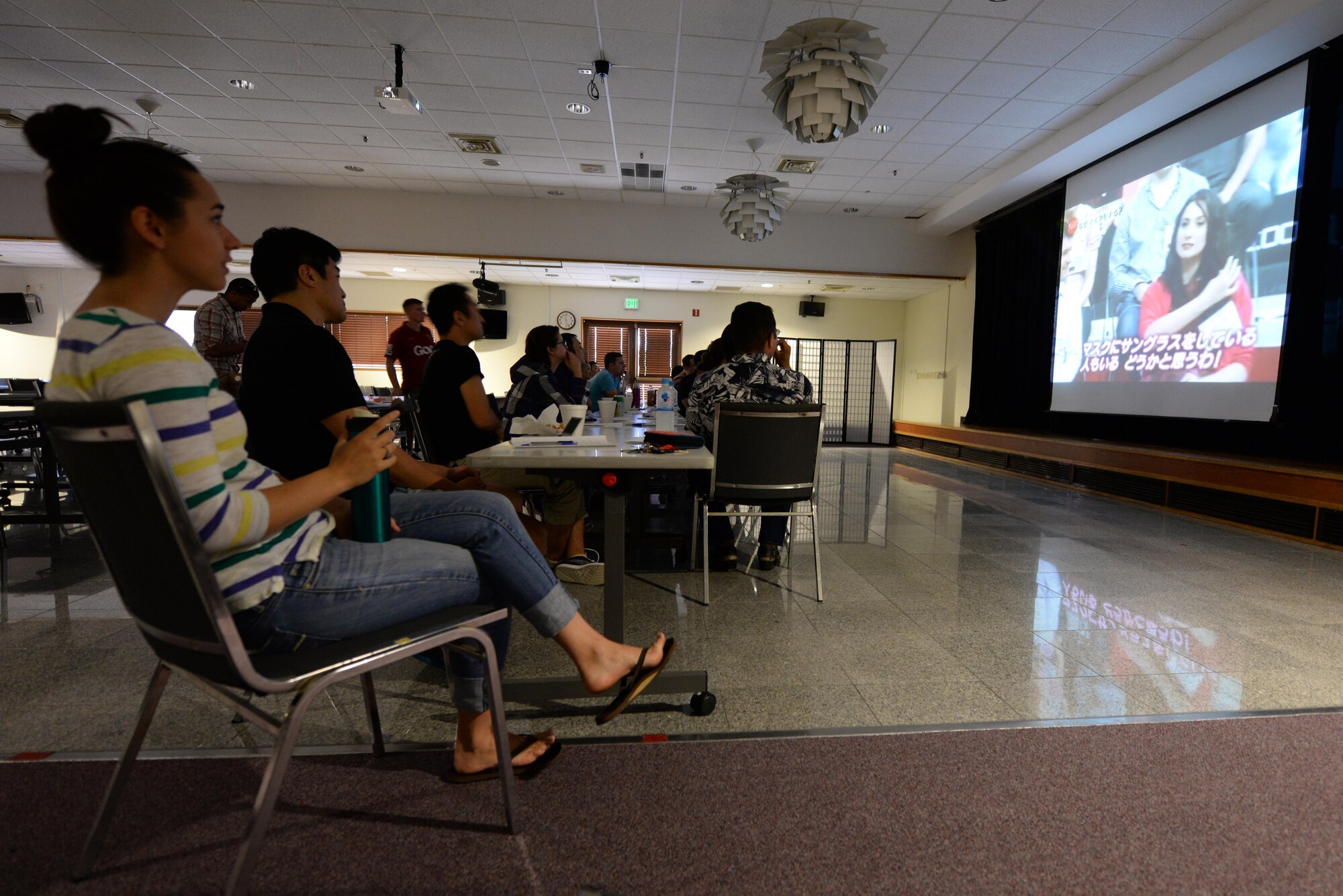 U.S. Air Force and Japan Air Self-Defense Force officers watch a video on Kadena Air Base, Japan, about common Japanese habits that appear abnormal to people of other nationalities during the Japanese English Mutual Study event June 20, 2015. The event’s purpose was to foster mutual understanding and camaraderie to boost host nation relations. (U.S. Air Force photo by Senior Airman Omari Bernard/Released)
