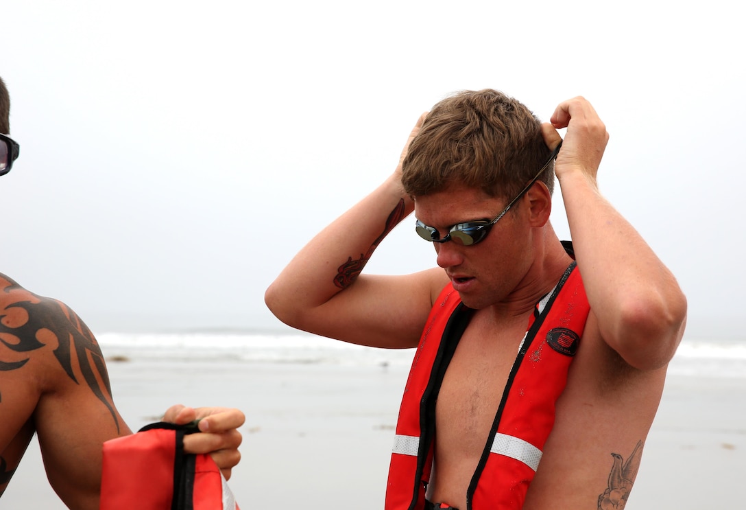 CORONADO, Calif. - A student in the Marine Corps Instructor of Water Survival (MCIWS) course prepares to conduct beach rescues in Coronado, California, June 19. After graduating the MCIWS course, the Marines will be qualified instructors and have American Red Cross certifications in Lifeguarding, CPR and First Aid.