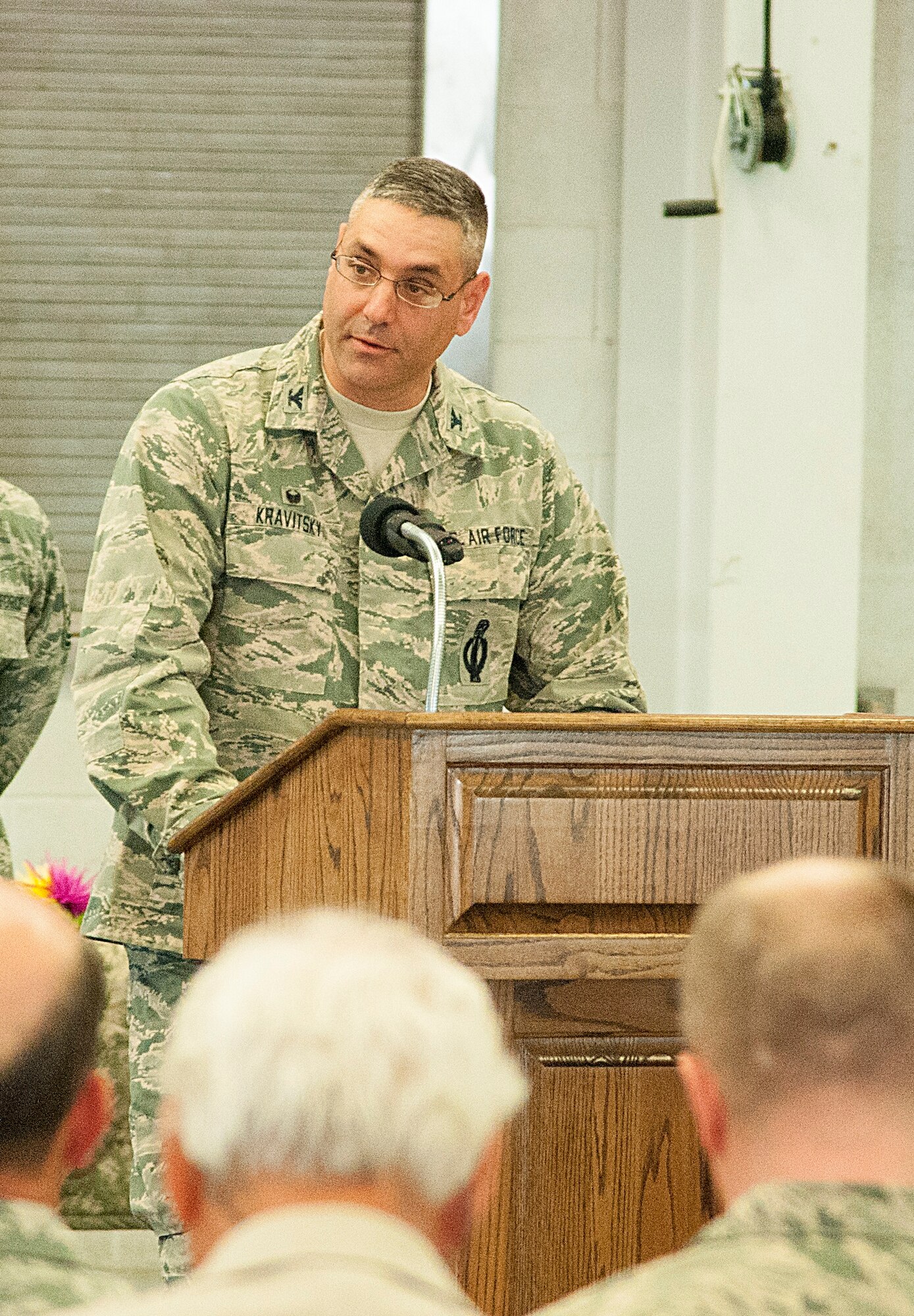 Col. Stephen Kravitsky, 90th Missile Wing commander, speaks at the 90th Security Forces Group Change of Command in the Peacekeeper High Bay on F.E. Warren Air Force Base, Wyo., June 29, 2015. Kravitsky spoke of why Col. Christopher Corley is the right man to assume command of the group. (U.S. Air Force photo by Senior Airman Jason Wiese)